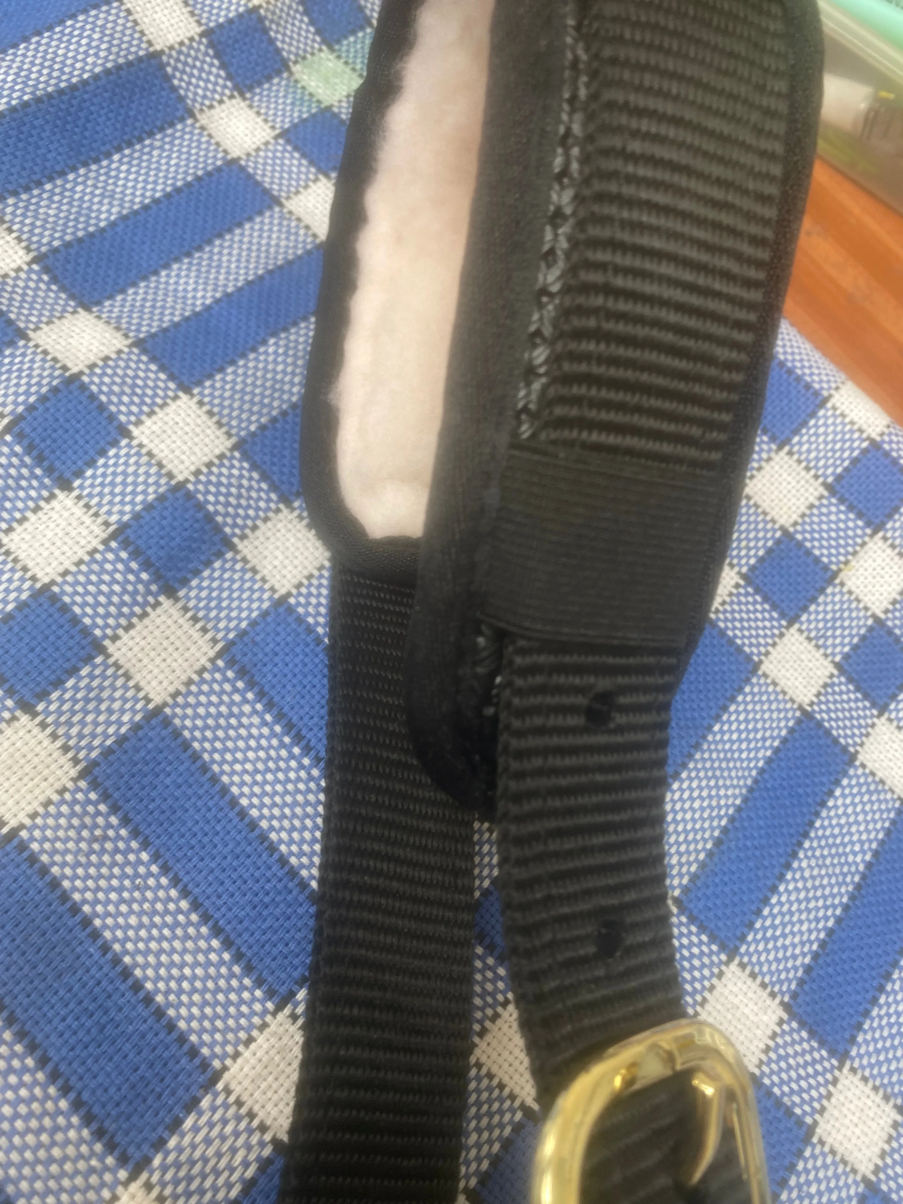 Shires black with brass cavesson headcollar
